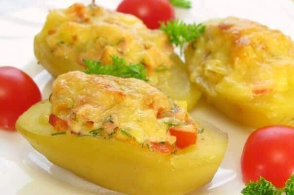 Baked potato with chicken, tomato, and cheese