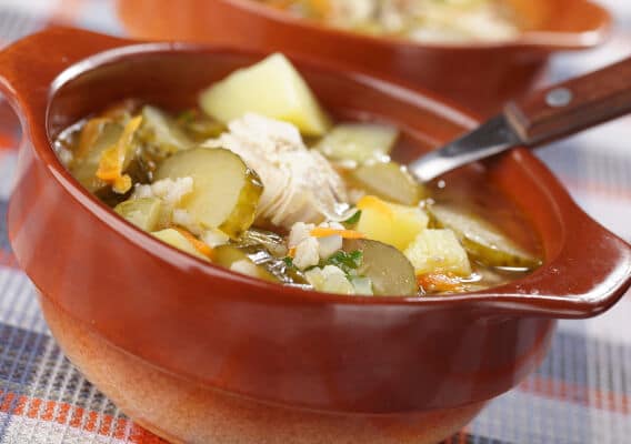 Sour cucumber soup with potato and carrot