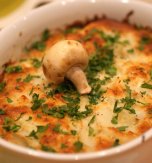 Potato baked pudding with mushrooms