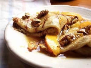 Pancakes with walnuts, raisins, and honey