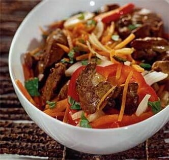Warm chicken liver, onion, carrot, and pepper salad