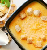 Potato, cheese, and carrot soup with chicken broth