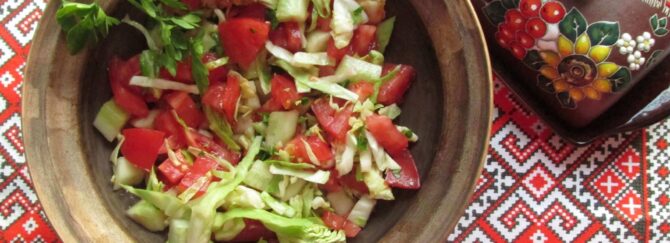 Cabbage, cucumber, and tomato salad dressed with olive oil